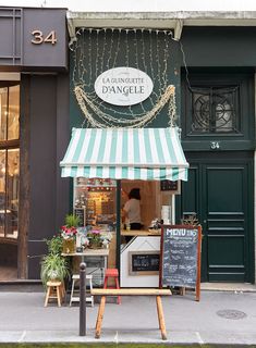 the outside of a restaurant with an awning