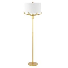 a gold floor lamp with a white shade