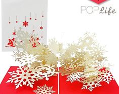 a pop up christmas card with snowflakes on it