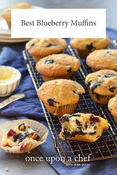 blueberry muffins are cooling on a rack