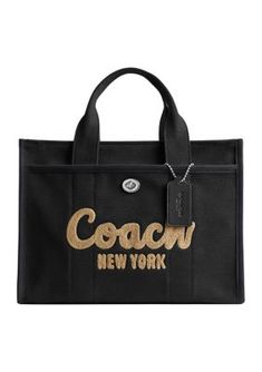 Large enough to fit a 13" laptop, this stylish cargo tote from COACH is perfect for travel. | COACH Cargo Tote Ootd Campus, Name Brand Purses, Brand Purses, Coach Tabby, Victoria Secret Fragrances, Treat Myself, Tas Bahu, Coach Tote Bags, Leather Crafting