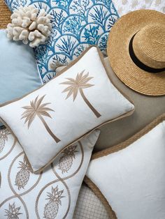 pillows, hats and other decorative items are arranged on top of each other in an arrangement