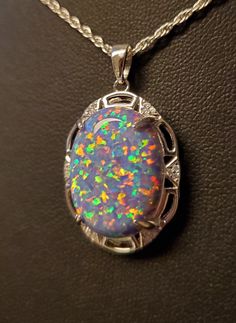 "Beautiful Large Favorite Lavender Purple Opal Necklace, 15x20mm Lab Created Opal With Multicolor Fire, See Video! 925 Sterling Silver Art Deco Style Pendant With Pave' CZs , 20\" Sterling Chain. Chain Length Options Available By Messaging Seller At Time Of Purchase. Gift Box Included." Silver Opal Necklace Fine Jewelry, Silver Opal Necklace In Fine Jewelry Style, Silver Opal Jewelry In Oval Cabochon Shape, Oval Large Pendant Jewelry For Anniversary, Silver Opal Jewelry For Collectors, Silver Jewelry With Large Oval Cabochon Pendant, Silver Cabochon Necklace Fine Jewelry, Silver Cabochon Necklace In Fine Jewelry Style, Silver Cabochon Fine Jewelry Necklace