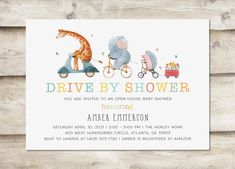 a baby shower card with an elephant and giraffe riding on a tricycle