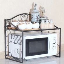 a microwave oven sitting on top of a counter next to a shelf filled with dishes