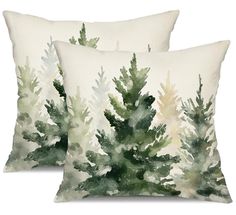 two pillows with watercolor trees on them