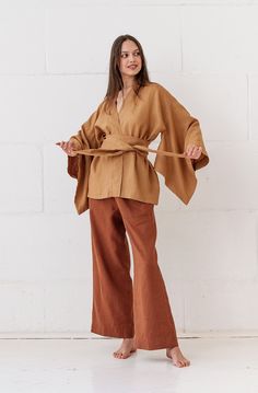 This linen kimono is very comfortable.  The kimono is perfect for any occasion. MODEL DETAILS * 3/4 Sleeves  * Medium weight linen * Color - toffee/ warm brown. Length about 64 cm / 25,20 inches. The width of the kimono measured flat is 61 cm  / 24,02 inches. One size. The kimono is made from Oeko-Tex-100 certified linen which is produced in Europe ( European flax ). It is pure softened linen. OEKO - TEX ® Standard 100 Certified linen fabric - guarantees you that it meets human-ecological requirements. We recommend hand washing in delicate detergents, so that linen can keep its charm for as long as possible. All our linen clothes are simple but we do believe the beauty is in simplicity. Made in a smoke-free home. * ready to ship. * *INFORMATION FOR ALL OUR CUSTOMERS** Please notice that im Fall Season Relaxed Fit Wrap Kimono, Linen Kimono With Relaxed Fit, Brown Wrap Kimono For Spring, Spring Brown Wrap Kimono, Linen Kimono With Kimono Sleeves For Loungewear, Elegant Linen Kimono With Kimono Sleeves, Brown Kimono With Kimono Sleeves For Spring, Beige Linen Kimono, Spring Linen Kimono