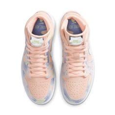 Dressed in pastel coral suede, the women's Air Jordan 1 Mid SE "P(HER)SPECTIVE" is adorned with multi-colored panels to give a dreamy look. To top it all off, the Swooshes and tongue tag comes in shiny chrome. A semi-translucent outsole in lilac completes the aesthetic. Wmns Air Jordan 1, Nike Air Jordan 5, Air Jordan 1 Mid Se, Womens Air Jordans, Air Jordan Sneakers, Air Jordan 1 Retro High, Air Jordan 3, Kids Jordans, Womens Shoes High Heels