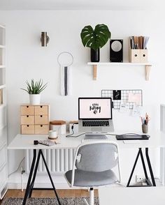 black and white photograph of a desk with a laptop