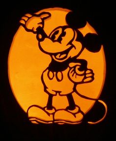 a cartoon character carved into the side of a pumpkin