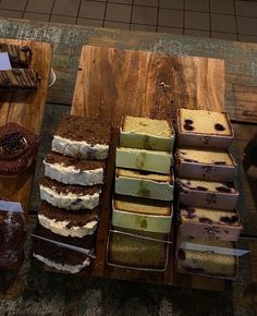 several different types of cakes on wooden trays