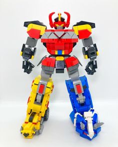 a lego robot that is standing next to each other