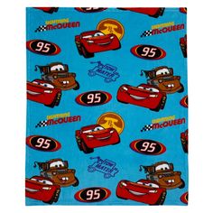 a blue towel with cars on it and the number 95 printed in red, white and blue