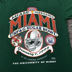 - Shirt Materials: 50% Cotton And 50% Polyester - Size: The Shirt Runs Bigger Than Usual. 5 Sizes Available: S, M. L, Xl, 2xl. - Ship: Fast Shipping. Made And Shipped From Usa. - Please Follow Me For New Items Vintage Logo Print Top For Game Day, Vintage Text Print Tops For Sports Events, 90s Graphic Print Tops For Fan Gear, Vintage Miami, Green Tee, Graphic Inspiration, University Of Miami, Please Follow Me, Sugar Bowl