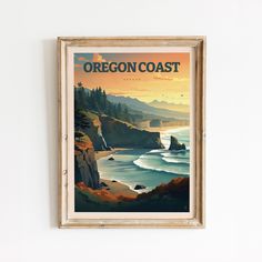 a framed poster hangs on the wall above a painting depicting an ocean and rocky coastline