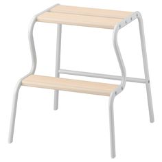 a white and wood step stool on a white background