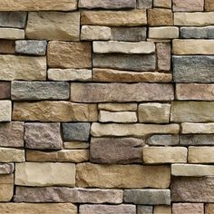 a stone wall that is made out of different colors