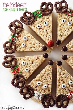 a pizza with pretzels and eyes on it is decorated to look like reindeer rice krispie treats