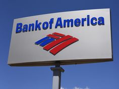 a bank of america sign is shown in front of a blue sky and white cloud