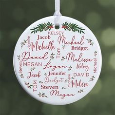 a personalized christmas ornament hanging from a tree