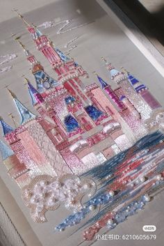 a close up of a piece of cloth with a castle on it