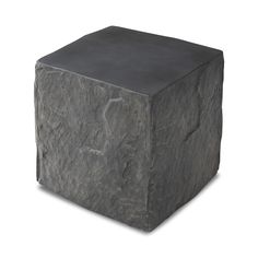 Cast black concrete features heavily textured sides that resemble natural slate, paired with a smoothed tabletop. | Four Hands Lucius End Table in Black | Mathis Home Black Stone Table, Marble Top End Tables, Copper Top Table, Black Concrete, Concrete Materials, Stone Table, Slate Stone, Outdoor Ottomans, Organic Decor