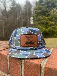 Introducing Rockwood Outdoors Logo Patch Hat in Lake Camo SnapBack Rope Style Hat. Wear this hat everyday casual, business or for the great outdoors. It goes perfect with any fit. Country Style Flat Brim Hat Bands For Outdoor, Country Style Hat With Curved Brim For Outdoor Activities, Country Style Flat Brim Hat For Outdoor Activities, Country Style Curved Brim Hat For Outdoor Activities, Casual 5-panel Outdoor Hat, Country Style Hat Bands For Outdoor, Summer Hiking Hat With Flat Bill, Casual Sun Hat With Short Brim For Hiking, Casual Hiking Sun Hat Cap