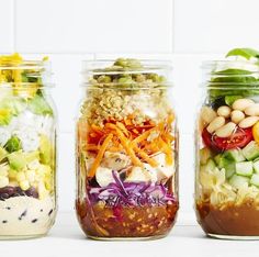 three mason jars filled with different types of salads and beans, all lined up