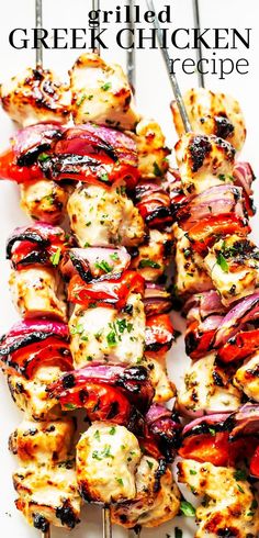 chicken kabobs on skewers with red onions and herbs