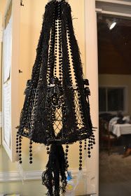 a black chandelier hanging from the ceiling