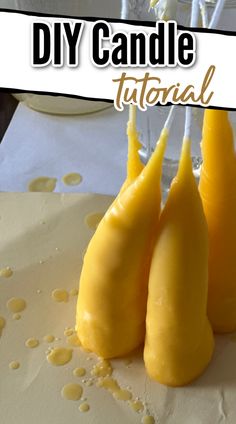 three yellow pears sitting on top of a table