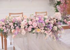 flowers are arranged on the back of a table