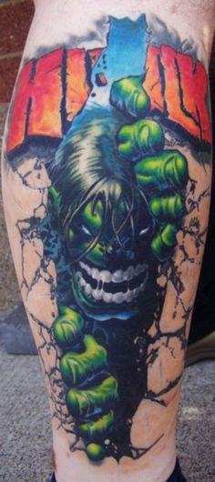 a man with a tattoo on his leg that has an image of a monster coming out of it