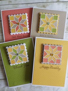 four cards with different designs on them