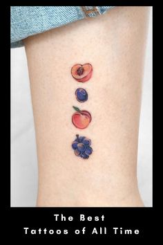 the best tattoos of all time are on this woman's leg and they look like fruit