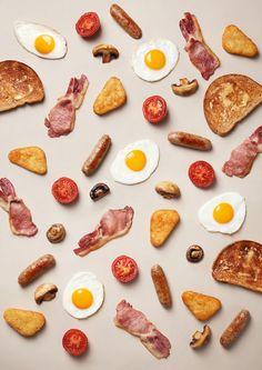 an assortment of breakfast foods laid out in the shape of a circle on a white surface