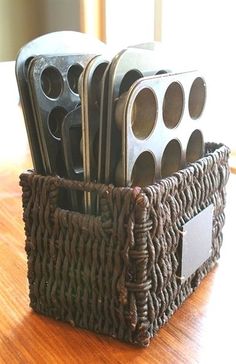 a brown basket filled with lots of metal items