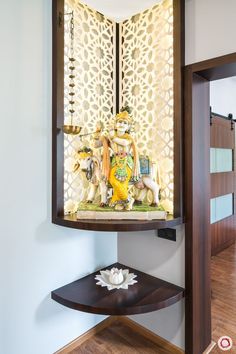 a decorative wall hanging in the corner of a room