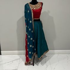 Indian Lehenga Choli With Heavily Embroidery On The Blouse Colors- Blue, Red, Gold Size- S Worn Once ( Excellent Condition) Transitional Blue Raw Silk Lehenga, Fitted Blue Silk Sharara, Blue Raw Silk Choli With Gota Work, Transitional Blue Silk Choli, Blue Silk Lehenga With Dori Work, Fitted Blue Traditional Wear With Gota Work, Blue Embroidered Silk Lehenga, Fitted Blue Raw Silk Salwar Kameez, Fitted Blue Silk Traditional Wear