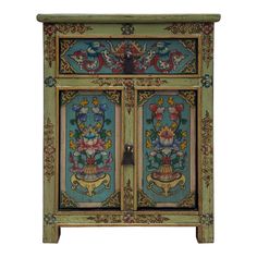 an ornately painted cabinet with flowers and leaves on the doors, is shown against a white background