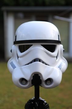 a star wars helmet on top of a tripod