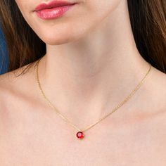 Features * Stylish red necklace with a solitaire pendant on an adjustable 18" chain, including 2-inch extension links. * Gold plated necklace for women with a round red pendant. Simple stone necklaces for women with an 8 mm red cubic zirconia stone. * Gold plated solid silver chain and pendant. This elegant gold necklace for women is made from 18K gold plated 925 Sterling Silver. * Cute gold necklaces for women and teenage girls. High-quality 18K gold plated 925 sterling silver handmade necklace Red Pendant Jewelry With Bezel Setting, Red Round Pendant Jewelry With Bezel Setting, Round Solitaire Necklace With Cable Chain As Gift, Gift Solitaire Necklace With Round Pendant On Cable Chain, Gift Solitaire Birthstone Necklace, Round Pendant Solitaire Necklace With Cable Chain, Solitaire Necklace With Round Pendant On Cable Chain, Red Charm Necklace For Gift, Valentine's Day Gift Necklaces With Bezel Setting