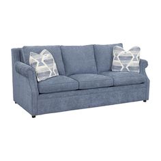 a blue couch with two pillows on it