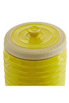 a yellow and white container with a lid