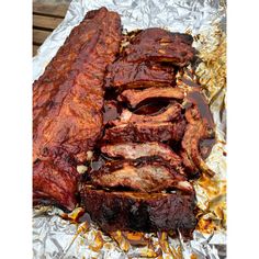 barbecue ribs on tin foil covered in sauce