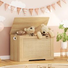 two teddy bears sitting on top of a wooden chest in a room with pink walls