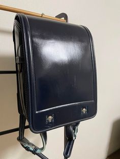 Randoseru : This randoseru made by Tsuchiya Bag company Which is one of the best randoseru maker in Japan. Its made by high quality Cowhide.  Item: Cowhide Leather school Bag / Japanese Randoseru - Black & Blue No.rnd018 Condition: Used/ Good. Please check the listing pictures. Size: Adult Wearable You could put your laptop without any ploblem. Tsuchiya Bag Company / Made in Japan Tsuchiya bag is one of the best randoseru maker in Japan. https://fujiyamarock.etsy.com Shipping Japan Post takes ab Functional Leather School Bag, Leather Bag For Back To School, Leather Bags For Students Back To School, Leather Bags For Students For Back To School, Leather School Bag For Back To School, Back To School Functional Satchel Shoulder Bag, Leather School Backpack With Adjustable Strap, Black Rectangular Satchel For Students, Adjustable Strap Leather Backpack For Students