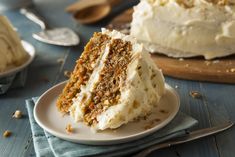 a slice of carrot cake on a plate with the rest of the cake in the background