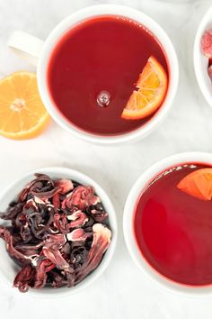 three white bowls filled with different types of drinks