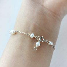 Delicate White Pearl Bracelet with Sterling Silver or 14K Gold Filled 💗 ✨ Dainty & Elegant. Simply beautiful bridal bracelet. A perfect gift & affordable treat for yourself. • Pearl size: 4 mm • Handmade with genuine white Freshwater Pearls. All metal parts are high-quality 925 Sterling Silver. It also can be made with 14K Gold-filled or Rose Gold-filled • Sterling Silver and 14K gold-filled are known for lasting quality. White proper care, this piece will last for decades and is considered a l White Pearl Bracelet, Sterling Silver Wire Wrap, Bridal Bracelet, Dainty Bracelets, Cute Bracelets, Pinky Ring, Bridal Necklace, Pearl Size, Wedding Bracelet